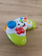 Fisher-Price Videojáték-kontroller utánzat, tanulós játék kisgyerekeknek német nyelvű zenével OUTLET termék