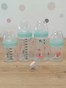 DODIE 4 db cumisüveg újszülötteknek, kerek anti-kólikás etetőcumival (2 x 150 ml és 2 x 270 ml) + 1 cumi újszülötteknek OUTLET termék